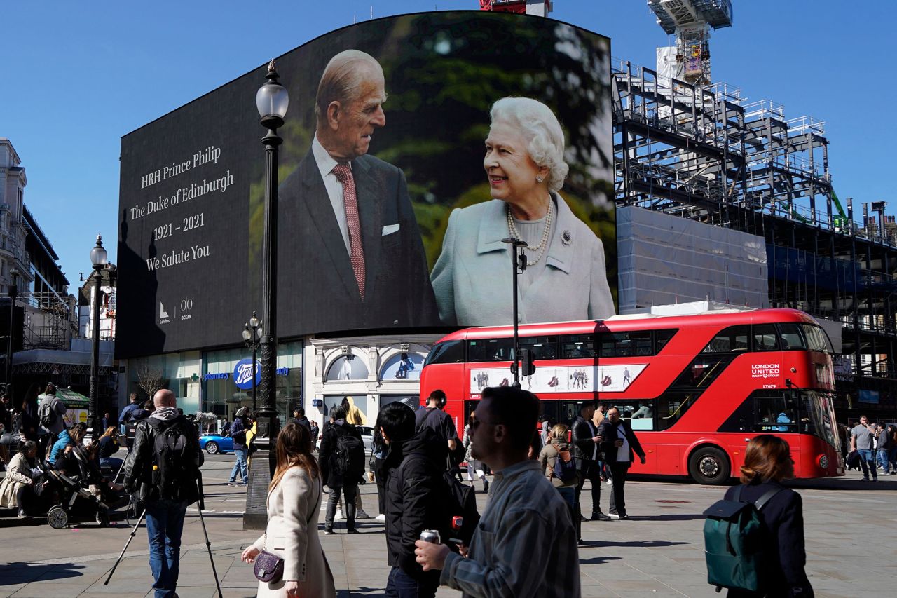 Images of the Queen and Prince Philip are displayed at London's Piccadilly Circus on Saturday.