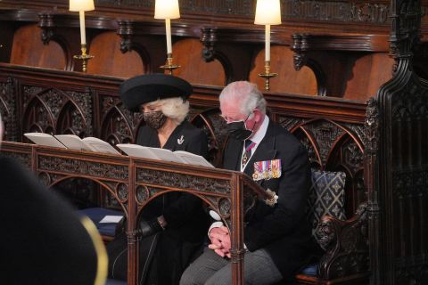 Prince Charles and his wife, Camilla, the Duchess of Cornwall, sit in St. George's Chapel during the funeral.