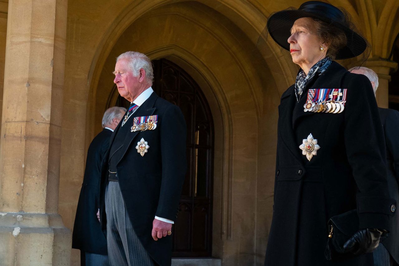 Prince Charles and Princess Anne prepare for the funeral procession to begin.