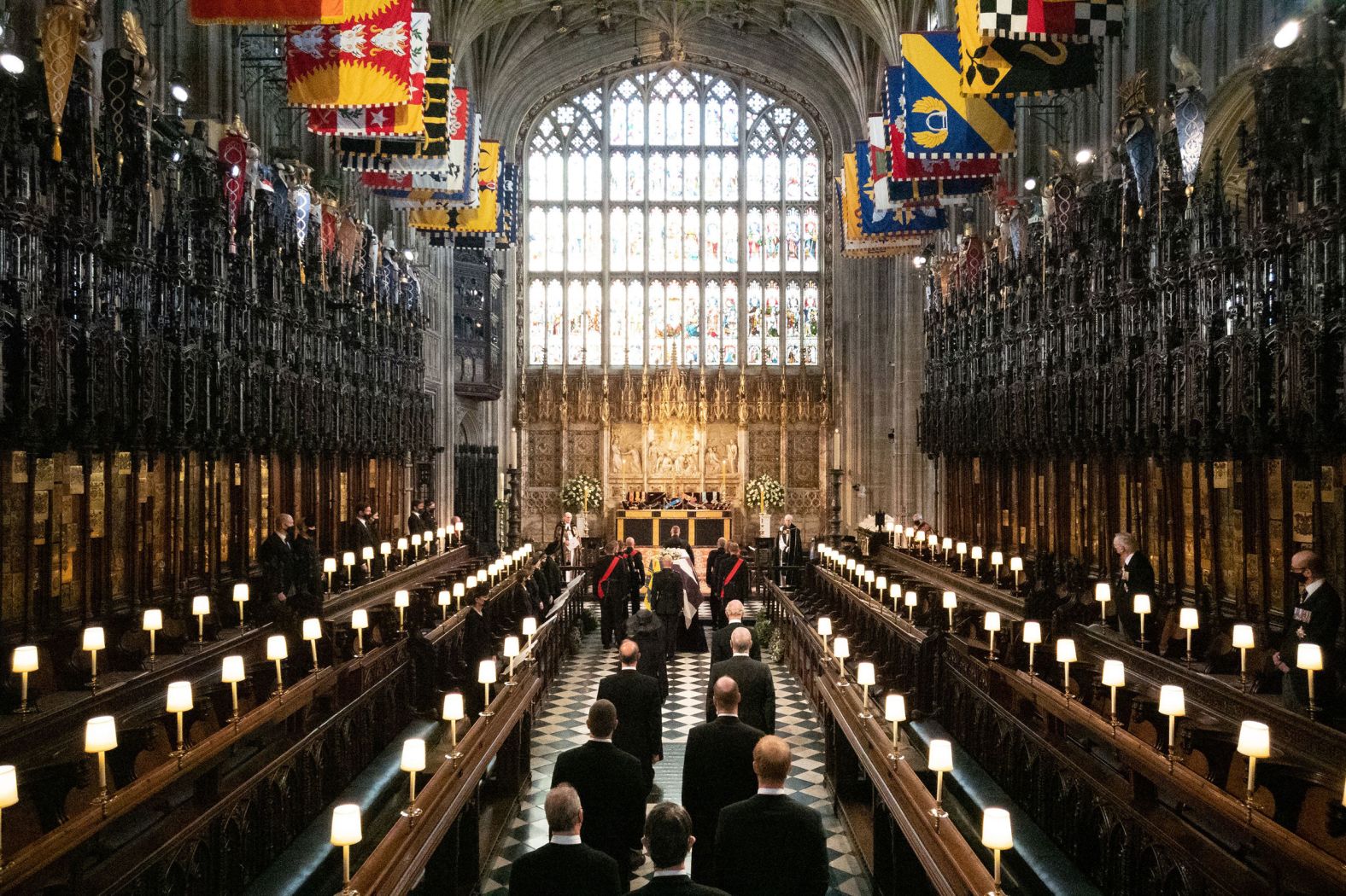 Members of the royal family follow Prince Philip's coffin into St. George's Chapel.