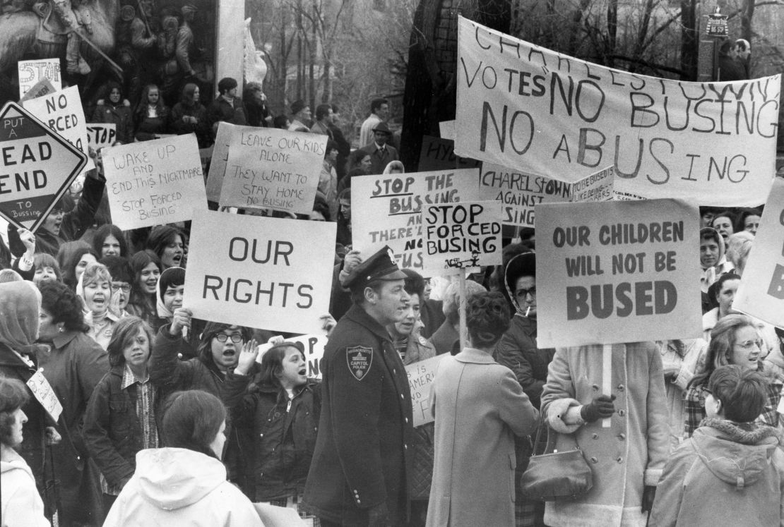 An anti-busing group holds a protest across from the Massachusetts State House in Boston on April 3, 1973. 