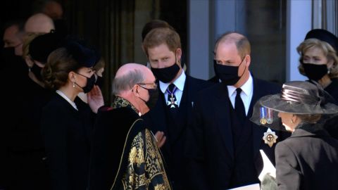 Prince William and his brother Prince Harry walk together after Prince Philip's funeral. 