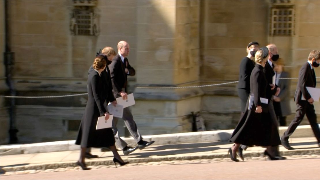 Prince William walks with his brother Prince Harry (center) and wife Catherine, Duchess of Cambridge, after Prince Philip's funeral.