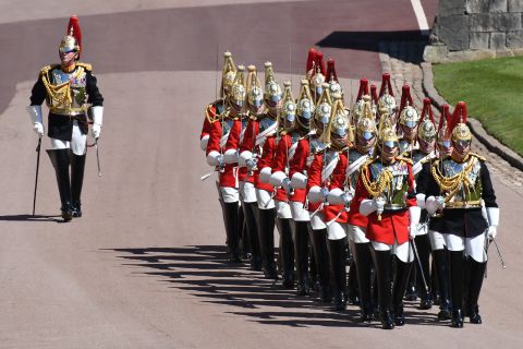 Members of the Household Cavalry march ahead of the funeral service.