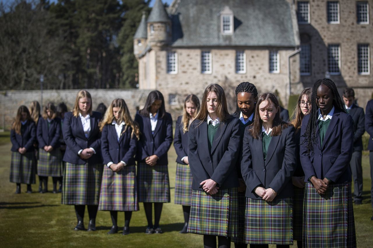 Students from Gordonstoun, Philip's former school, observe a minute of silence Saturday in Moray, Scotland.