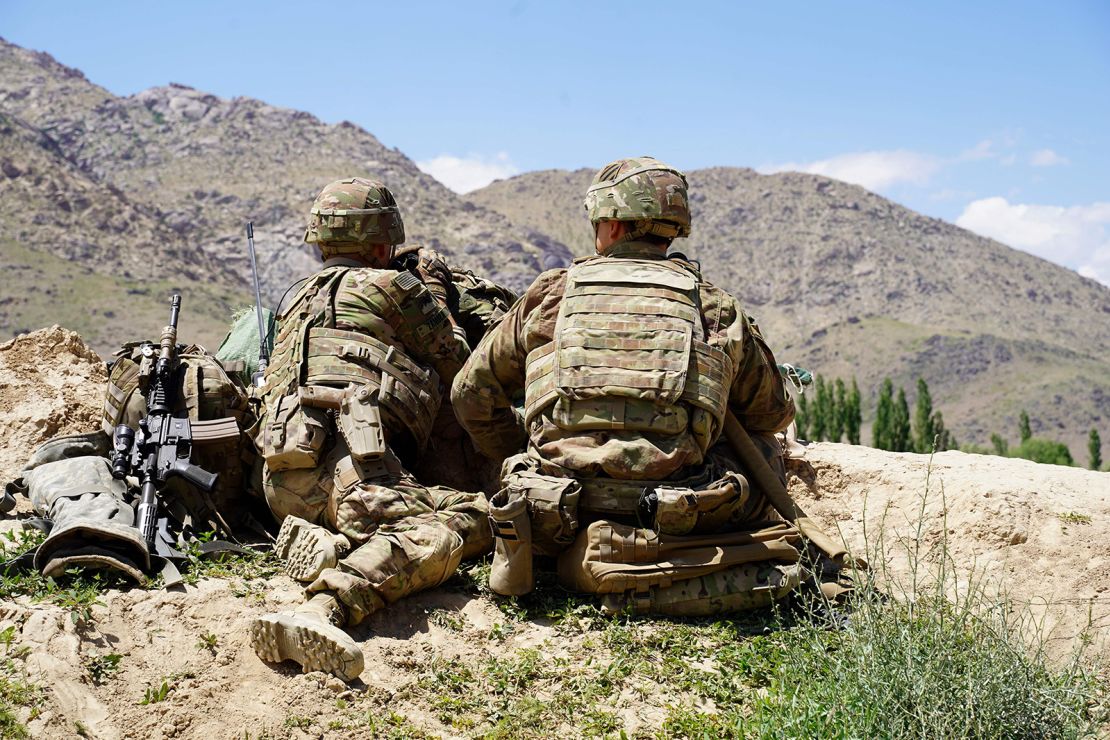 US soldiers look out over hills during a visit of the commander of US and NATO forces in Afghanistan, General Scott Miller, in Wardak province on June 6, 2019.