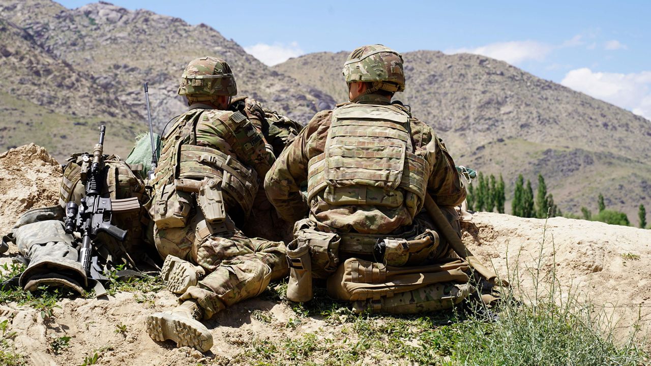 US soldiers look out over hills during a visit of the commander of US and NATO forces in Afghanistan, General Scott Miller, in Wardak province on June 6, 2019.