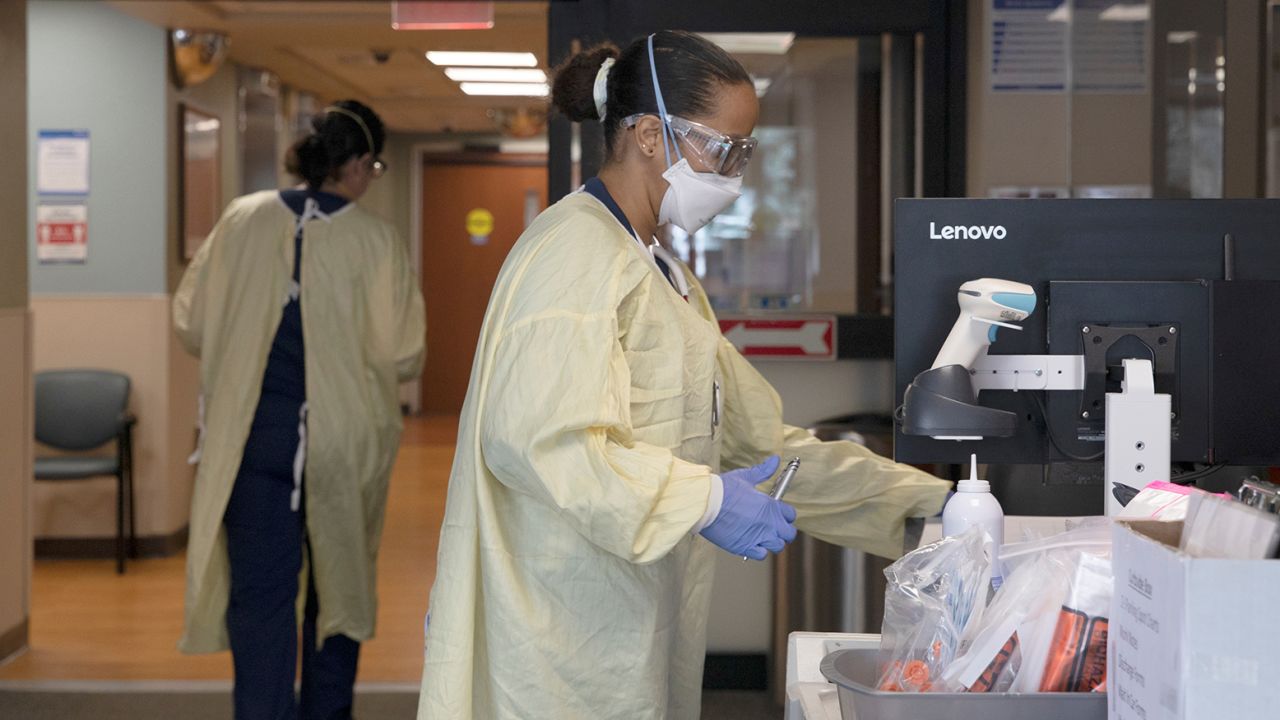 Nurses file paperwork for patients at Beaumont Hospital in Grosse Pointe, Michigan, on April 16, 2021