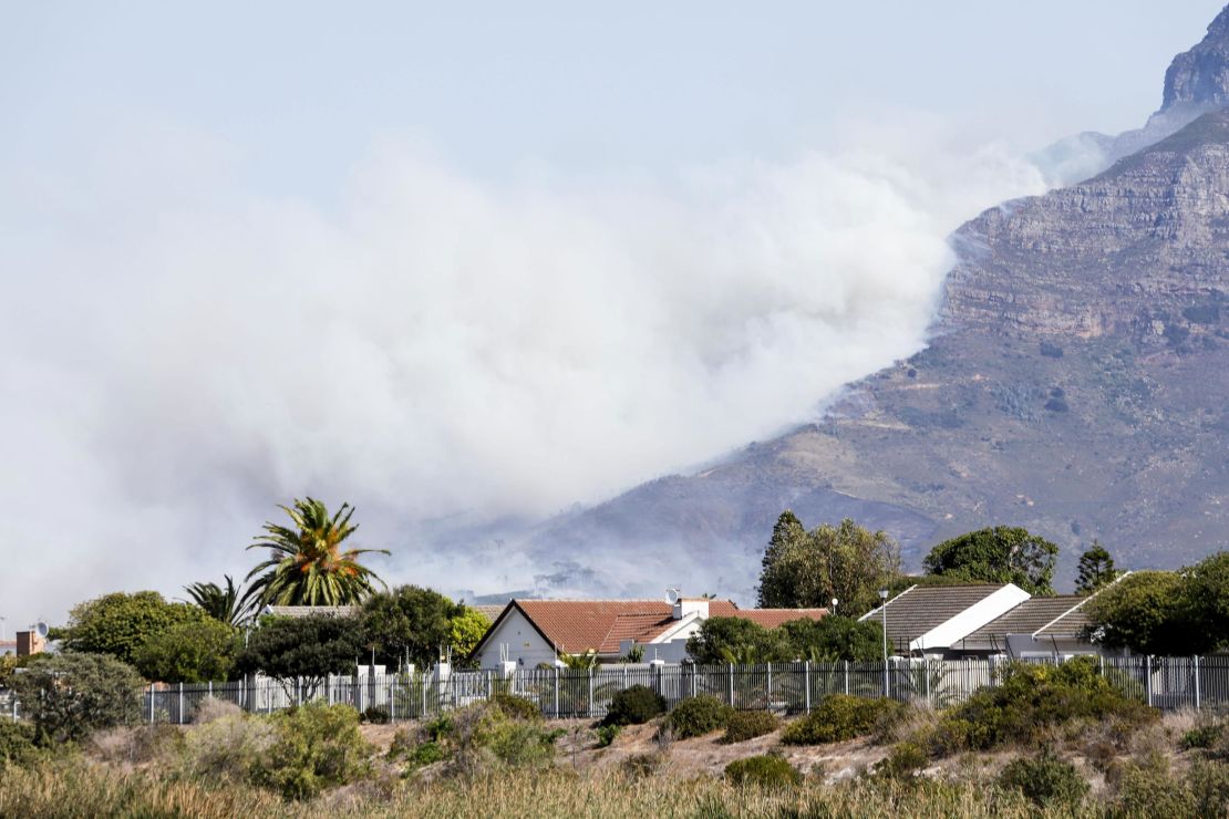 Heavy smoke rises from Table Mountain in Cape Town.