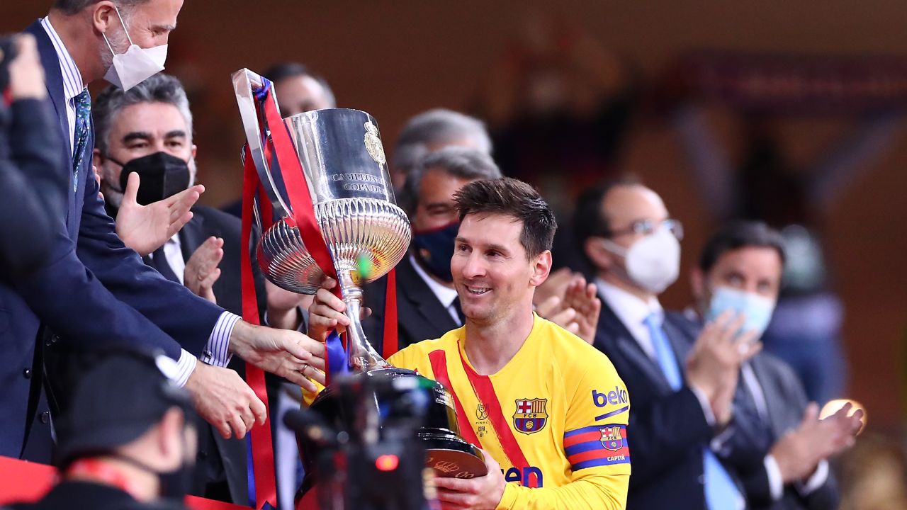 Lionel Messi of FC Barcelona lifts the trophy after winning the Copa Del Rey Final match between Athletic Club and Barcelona at Estadio de La Cartuja on April 17, 2021 in Seville, Spain.