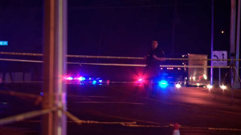 Police tape surrounds a road in Columbus, Ohio, where a shooting left one woman dead and five others wounded on Saturday.