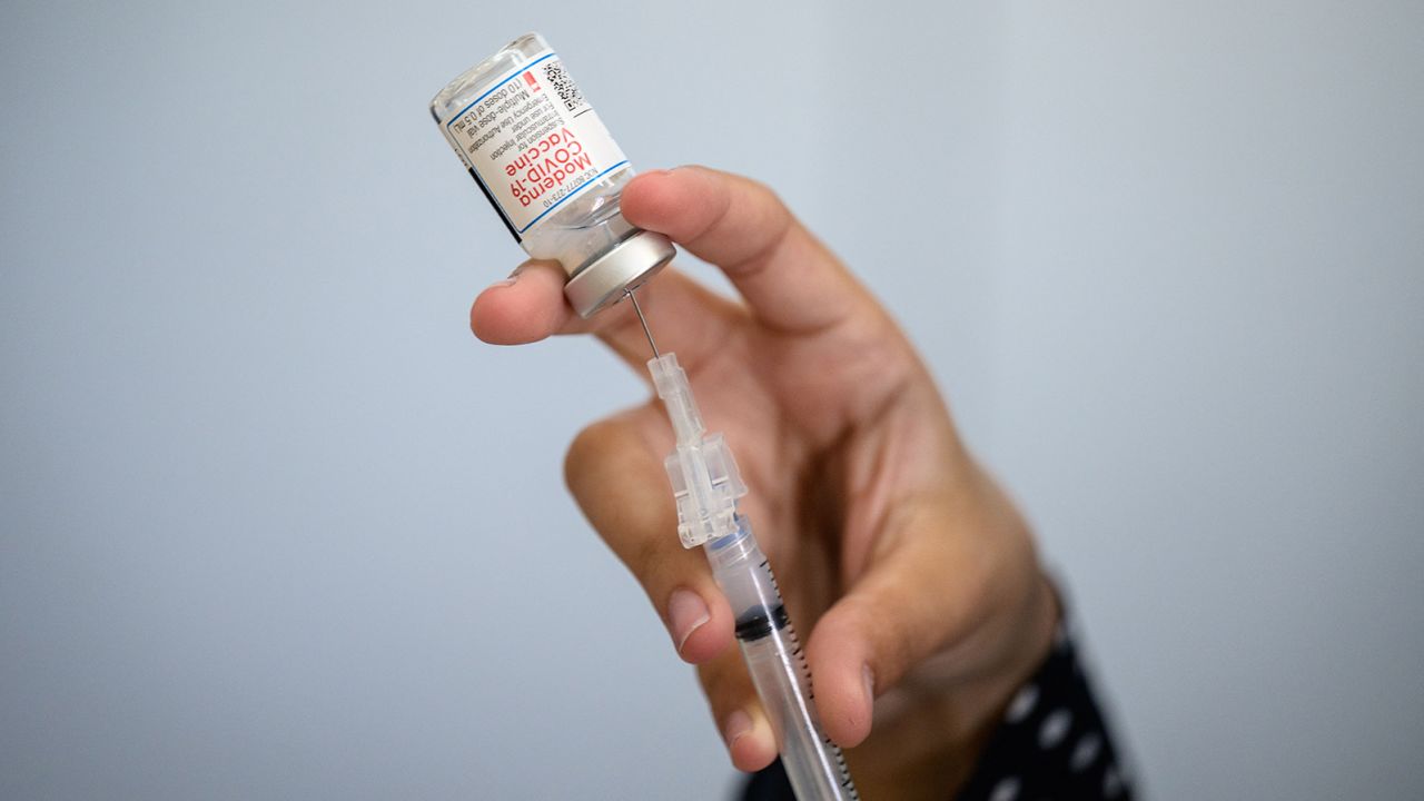 A medical staff member prepares a syringe with a vial of the Moderna Covid-19 vaccine at a pop up vaccine clinic at the Jewish Community Center on April 16, 2021 in the Staten Island borough of New York City. (Photo by Angela Weiss / AFP) (Photo by ANGELA WEISS/AFP via Getty Images)