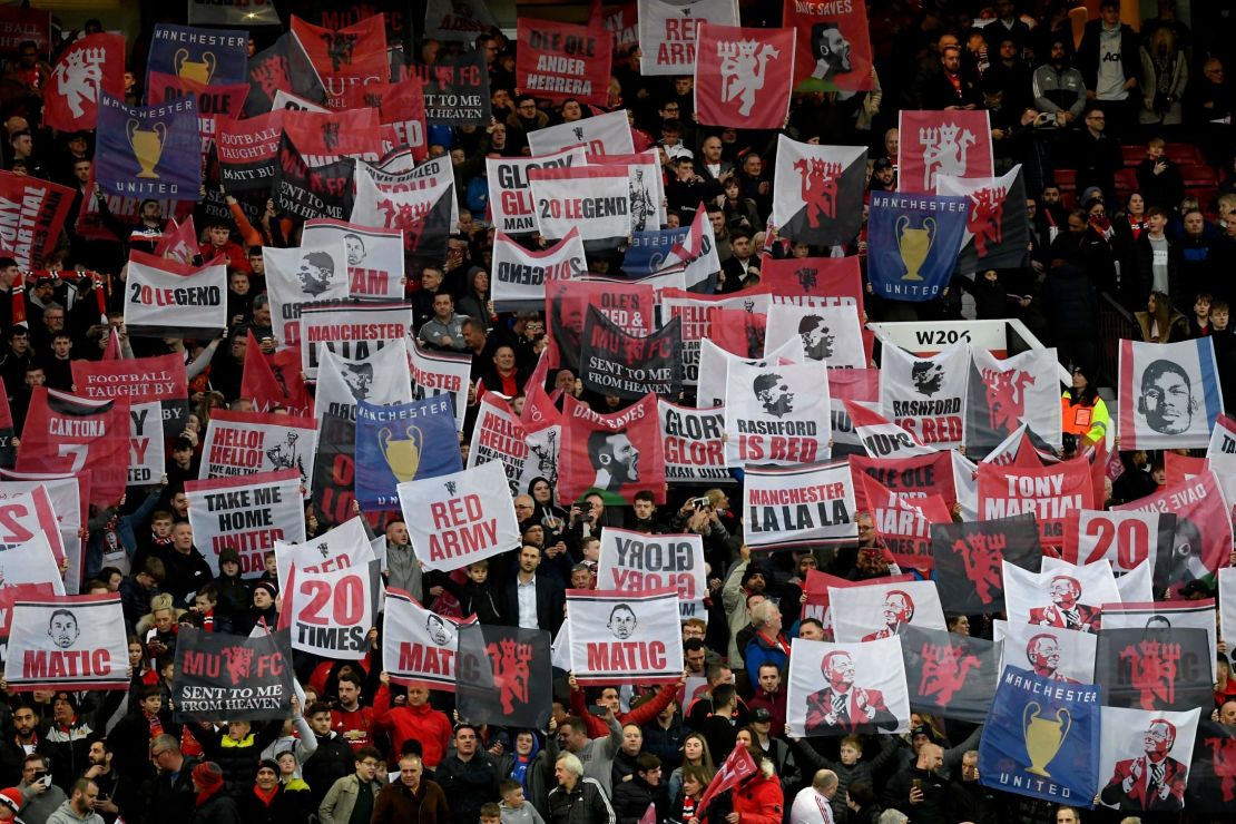 Manchester United fans hold up banners during their side's Champions League quarterfinal against Barcelona in 2019. 
