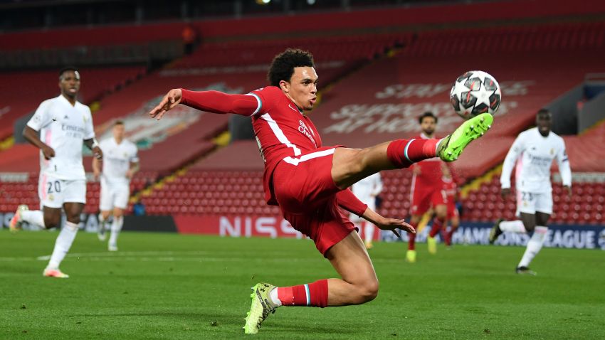 LIVERPOOL, ENGLAND - APRIL 14:  Trent Alexander-Arnold of Liverpool controls the ball during the UEFA Champions League Quarter Final Second Leg match between Liverpool FC and Real Madrid at Anfield on April 14, 2021 in Liverpool, England. Sporting stadiums around the UK remain under strict restrictions due to the Coronavirus Pandemic as Government social distancing laws prohibit fans inside venues resulting in games being played behind closed doors.  (Photo by Shaun Botterill/Getty Images)