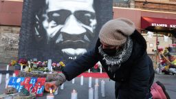 Community activists light candles at a memorial near the site where George Floyd died at the hands of former Minneapolis police officer Derek Chauvin on March 28, 2021 in Minneapolis, Minnesota. 