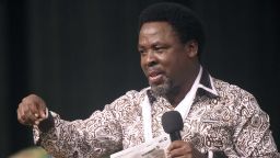 Nigerian pastor TB Joshua speaks during a New Year's memorial service for the South African relatives of those killed in a building collapse at his Lagos megachurch on December 31, 2014.  A spokesman at Joshua's Synagogue Church of All Nations (SCOAN) said 44 South Africans have flown to Lagos to attend the ceremony following the September disaster which killed 116 people, including 81 South Africans.
AFP PHOTO/PIUS UTOMI EKPEI        (Photo credit should read PIUS UTOMI EKPEI/AFP via Getty Images)