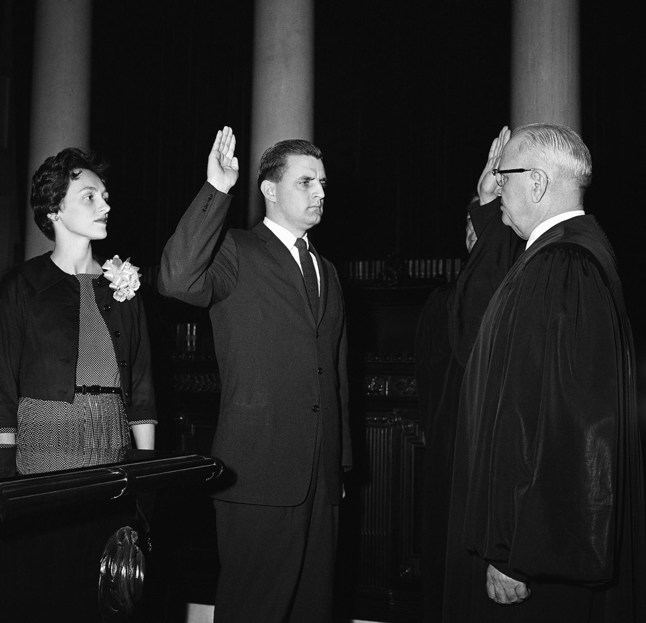 Mondale is sworn in as Minnesota Attorney General by Minnesota Supreme Court Chief Justice Roger Dell, right, on May 5, 1960, in St. Paul, Minnesota.