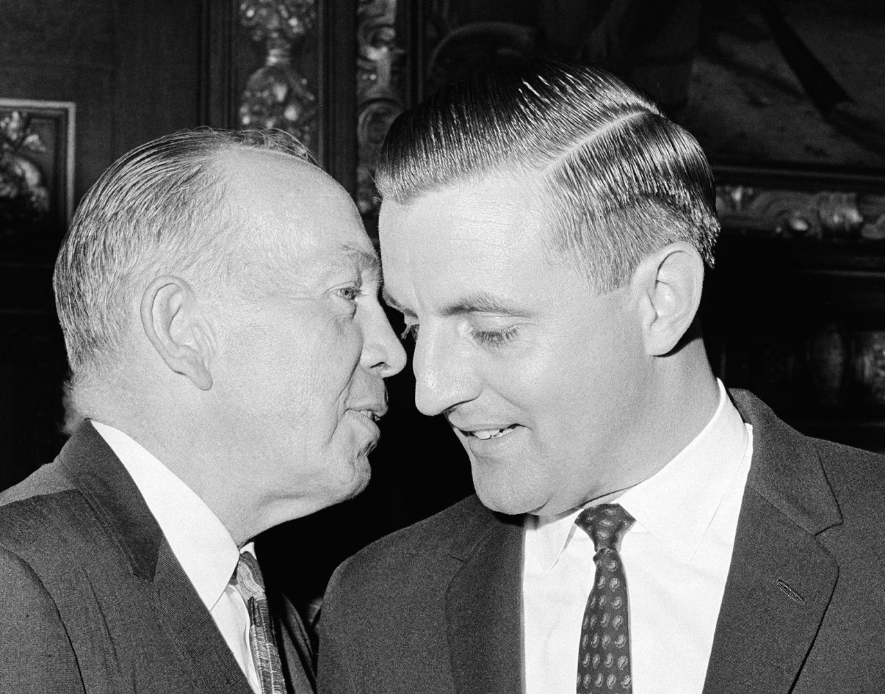 Mondale smiles while speaking to Minnesota Gov. Karl Rolvaag on November 17, 1964. Rolvaag appointed Mondale to the US Senate after Hubert H. Humphrey was elected vice president.