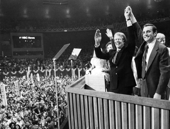 Jimmy Carter and Mondale clasp hands after their acceptance speeches for the Democratic presidential ticket at the Democratic National Convention at Madison Square Garden in Manhattan on July 15, 1976.