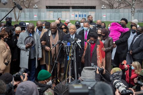 The Rev. Al Sharpton leads a prayer alongside Floyd's family members and politicians outside the Hennepin County Government Center in Minneapolis on Monday, April 19.