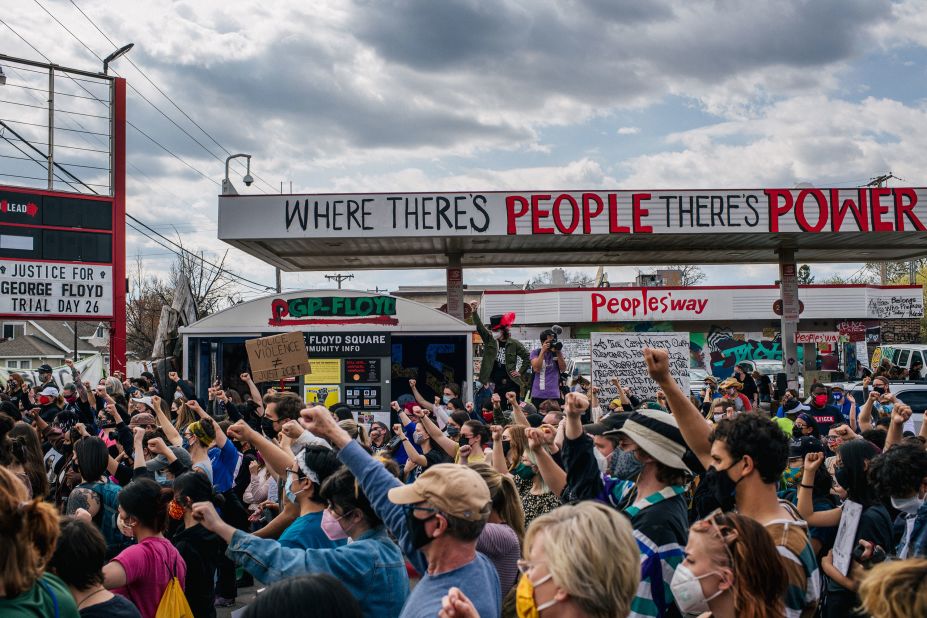 People gather for a demonstration on Sunday, April 18, at the site where George Floyd died in Minneapolis.