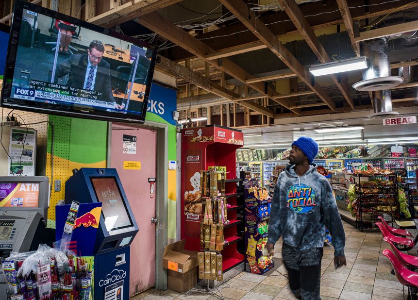 Roland Jackson looks at a television showing the trial while getting some breakfast inside the Cup Foods in Minneapolis on March 29.