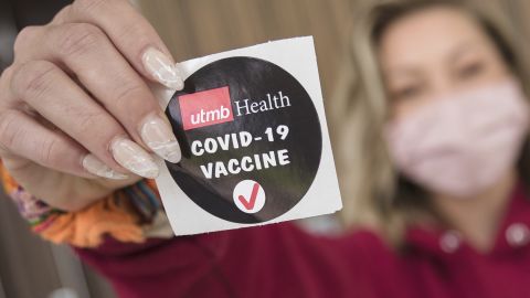 A patient displays a sticker proclaiming her recent Covid-19 vaccination in Lake Jackson, Texas, March 28. Think twice before announcing your vaccine status to friends and family and on social media platforms. 