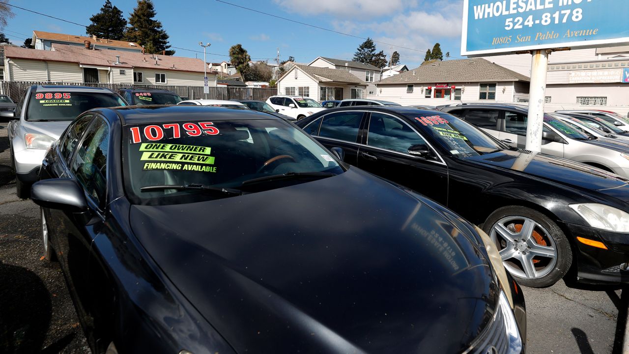 Used cars sit on the sales lot in El Cerrito, California. 