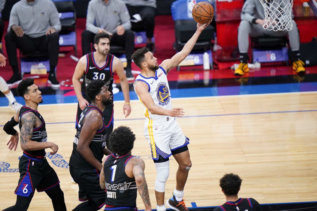 Curry goes for a shot during the first half of the game against the Philadelphia 76ers.