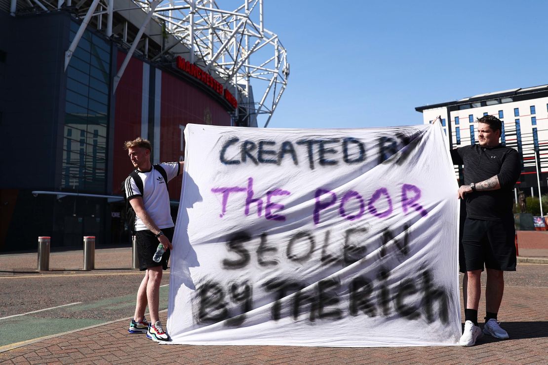 Football fans opposing the European Super League outside Old Trafford in Manchester. 