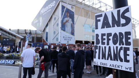 A fan sign is seen reading "Fans before finance, All fans aren't we" as a protest against the European Super League outside Elland Road prior to the match between Leeds United and Liverpool on April 19.