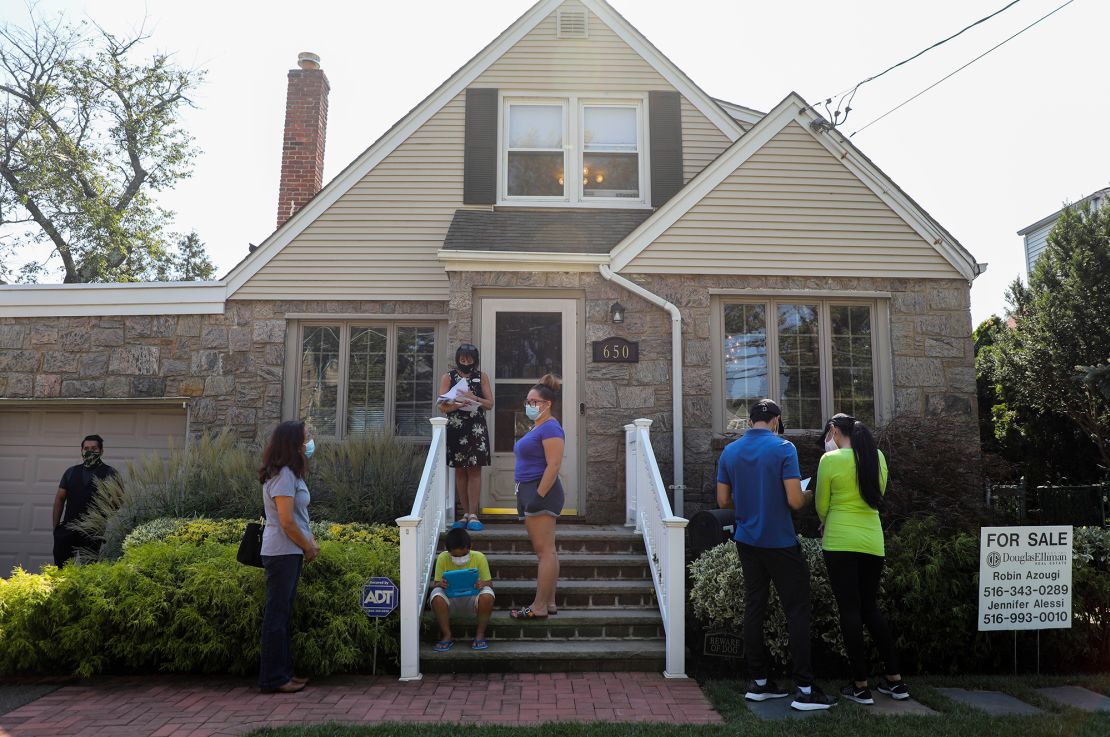 People wait to visit a house for sale in Floral Park, New York, on Sept. 6, 2020.