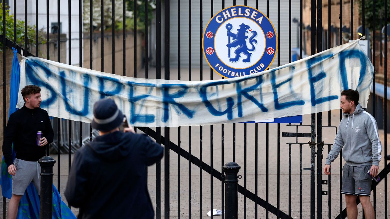 Chelsea fans put up a banner outside Stamford Bridge protesting the Super League.