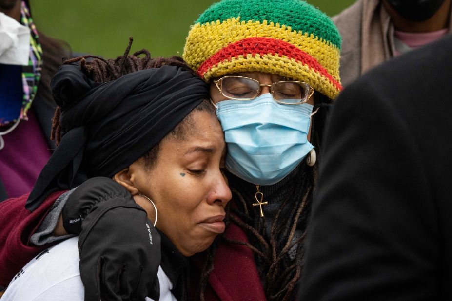 People embrace during a news conference in Minneapolis before the verdict on April 20.