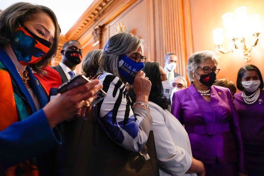 Members of the Congressional Black Caucus listen to the conclusion of the trial from Capitol Hill.