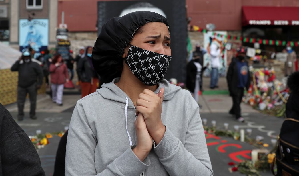 A woman reacts to the verdict at George Floyd Square in Minneapolis.