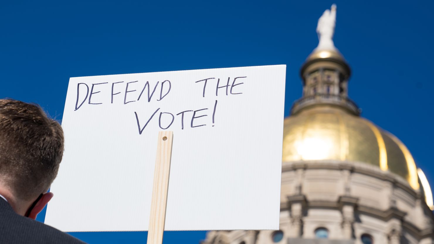 Demonstrators stand outside of the Capitol building in opposition of House Bill 531 on March 8, 2021, in Atlanta, Georgia. 