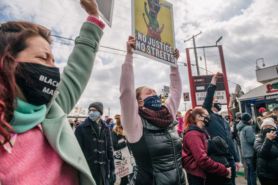 People celebrate in Minneapolis at the site where George Floyd was killed.