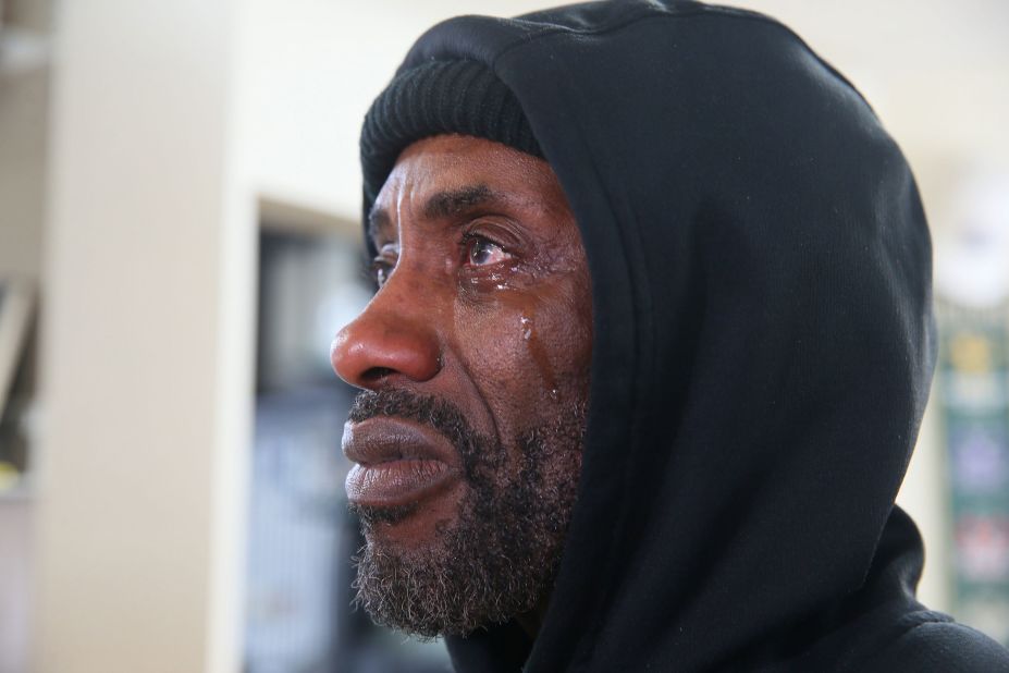 Adi Armour cries while watching the verdict being read in Milwaukee.