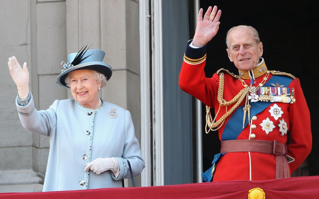 The Queen and Prince Philip wave from the balcony of Buckingham Palace after the Trooping the Colour parade on June 11, 2011.