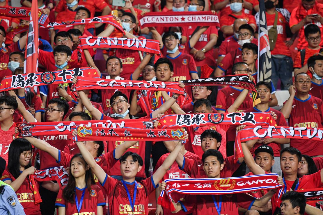 Fans cheer during the Guangzhou derby, the opening match of the new Chinese Super League season, on April 20 in Guangzhou, China. 