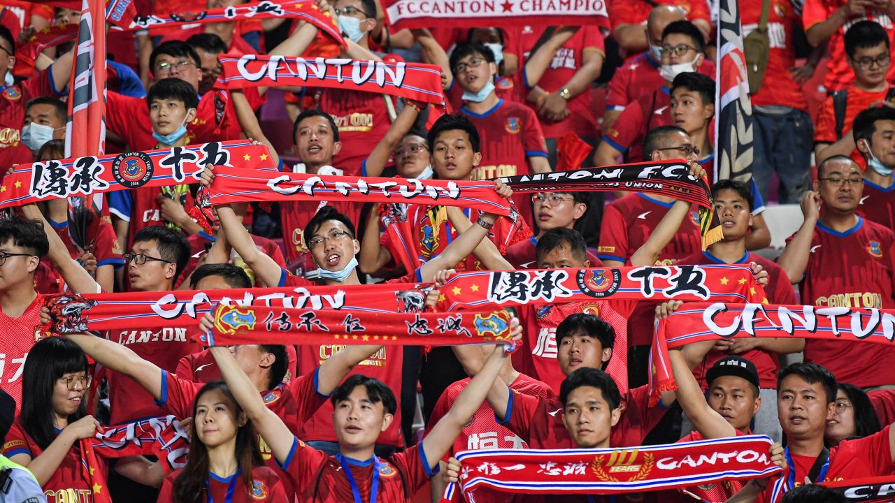 Fans cheer during the Guangzhou derby, the opening match of the new Chinese Super League season, on April 20 in Guangzhou, China.