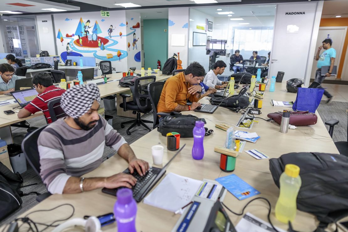 Employees work on laptop computers at the Flipkart  headquarters in Bengaluru, India. 