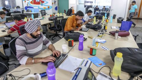 Employees work on laptop computers at the Flipkart  headquarters in Bengaluru, India. 