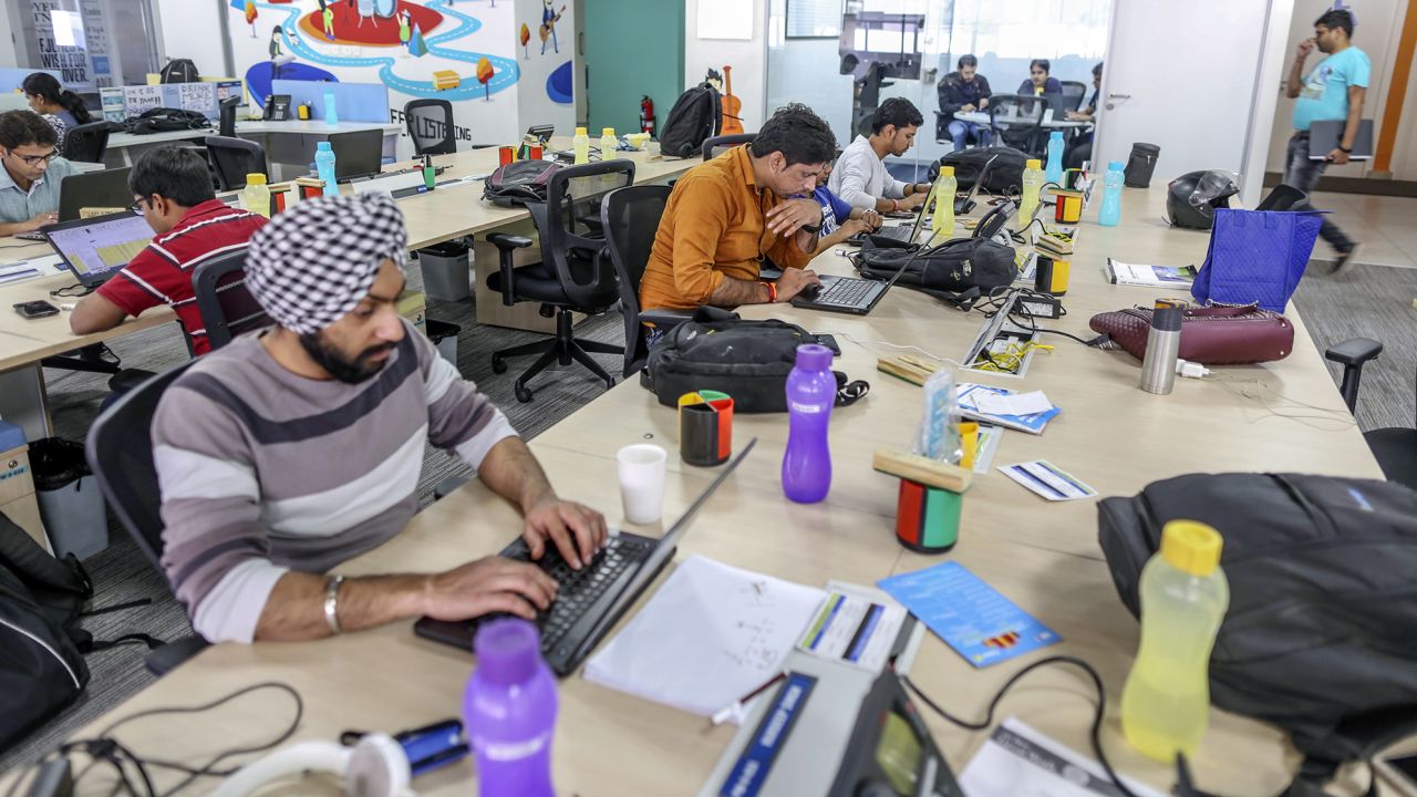 Employees work on laptop computers at the Flipkart headquarters in Bengaluru, India.