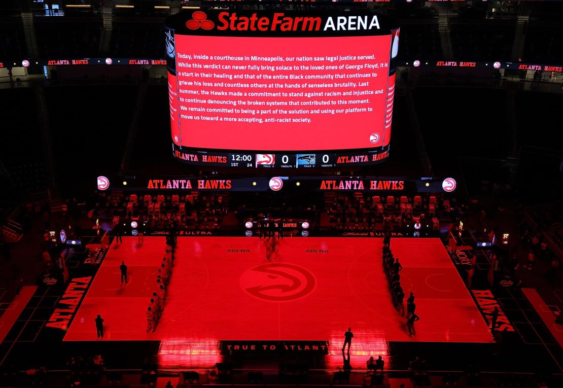 The Atlanta Hawks and Orlando Magic observe the guilty verdicts in the Derek Chauvin trial prior to a game at State Farm Arena on April 20, 2021 in downtown Atlanta.