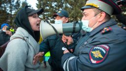 A woman argues with police officer during a protest in support of jailed opposition leader Alexei Navalny in Ulan-Ude, the regional capital of Buryatia, a region near the Russia-Mongolia border, Russia, Wednesday, April 21, 2021. Navalny's team has called for nationwide protests on Wednesday following reports that the politician's health was deteriorating in prison, where he has been on hunger strike since March 31. Russian authorities have stressed that the demonstrations were not authorized and warned against participating in them. (AP Photo/Anna Ogorodnik)