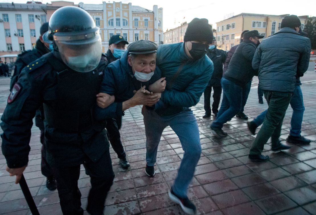 Police officers detain a protester in Ulan-Ude.