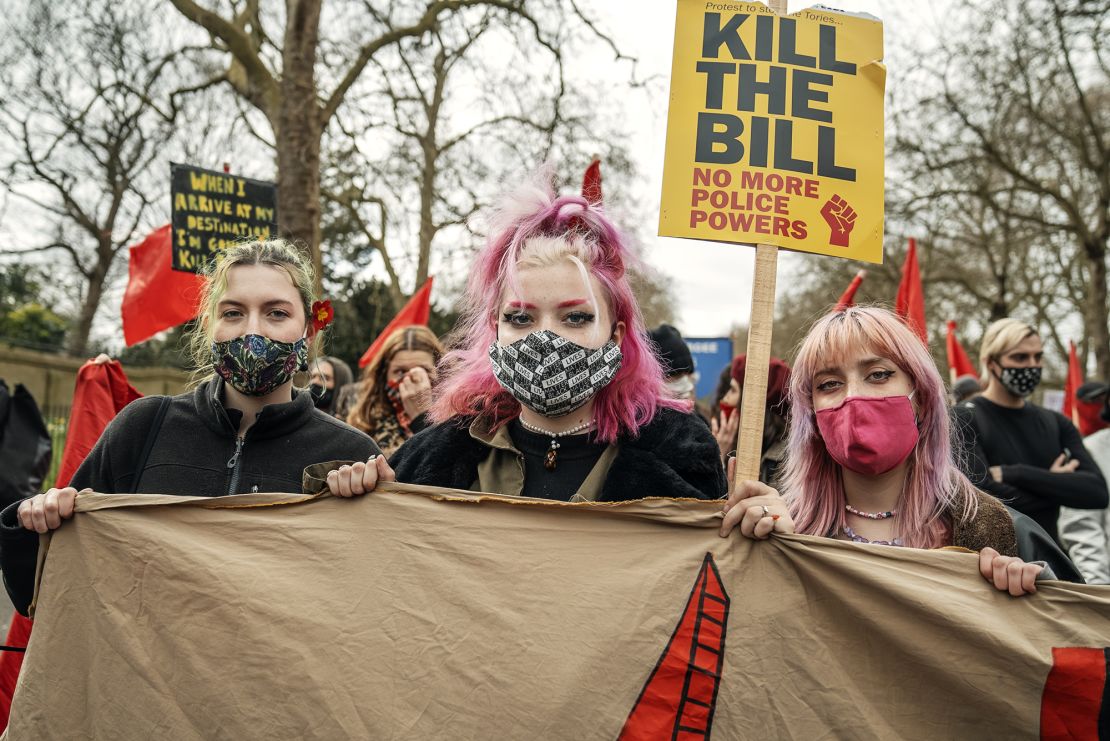 From left, Hannah Alack, Lily-Rose Butterfield and Ramona Wolf attend a "Kill the Bill" protest in London.