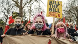 Hannah Alack, Lilly Rose Butterfield, and Ramona Wolf attend a feminist "Kill the Bill" protest in London. Butterfield said her own experience of sexual assault had prompted her to tattoo parts of her body to demarcate her "physical boundaries." [Date: April 3]